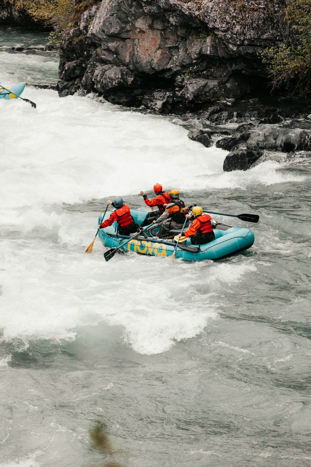 People white-water rafting together on a river